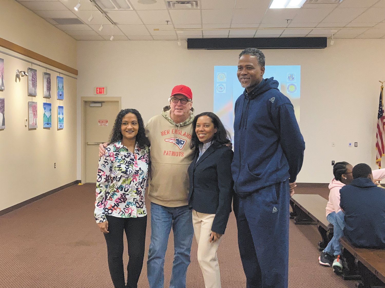 NONPROFIT SUPPORT: Individuals came out to support Wilda Gutierrez’s (far left) Esperanza Hope including Mayor Ken Hopkins, Rhode Island Lieutenant Governor Sabina Masos and founder and president of Lights and Sirens International Ibn Bakari.